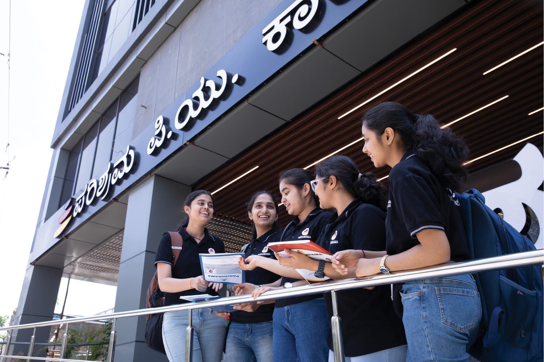 Students outside the Parishrama PU College Davangere campus entrance